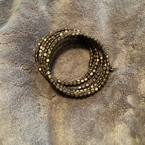 Dark gold colored stretchy bracelet, fossil brand.